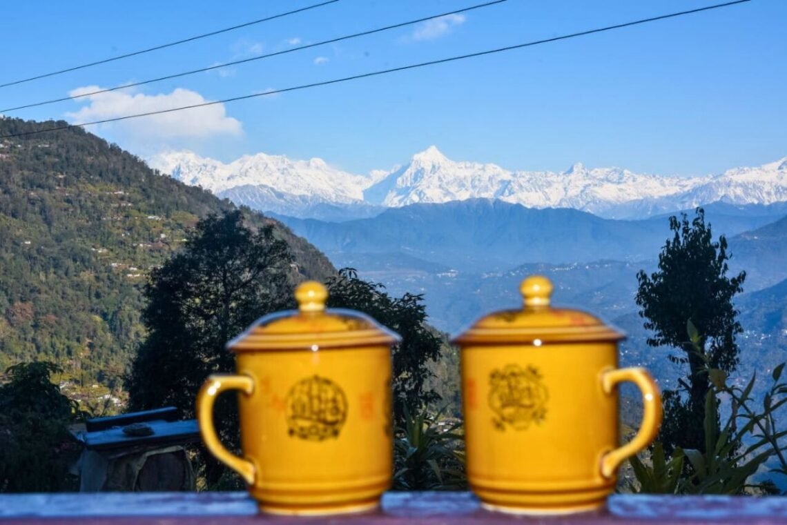 Kolakham, a picturesque village in West Bengal, offers majestic Kanchenjunga views, dense forests, waterfalls, and peaceful mountain vibes.